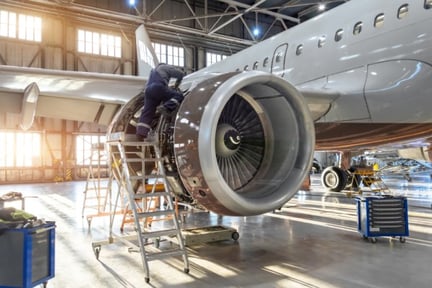 Man working on jet engine